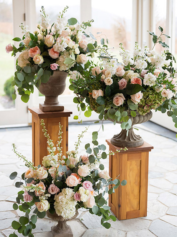 floral arrangements on pedestals